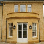 White Timber entrance door at a new development